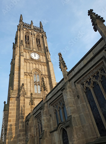 view of the tower and main building of the historic saint peters minster in leeds formerly the parish church completed in 1841