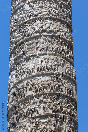 Architectural detail from of ancient Marcus Aurelius Column in front of Palazzo Chigi in city of Rome, Italy