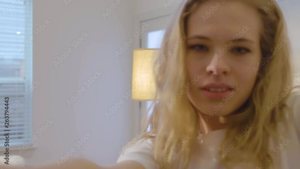 Slow motion close up of a young female dancing in a provocative way close to the camera's point of view, 29.97 fps. Slow motion close up of a young female dancing in a provocative way close to the camera's point of view, 29.97 fps.