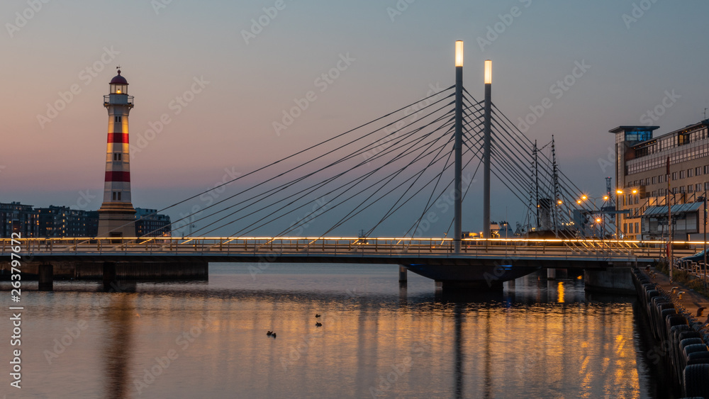 A beautiful Malmo view with a lighthouse and a modern bridge over the hamn