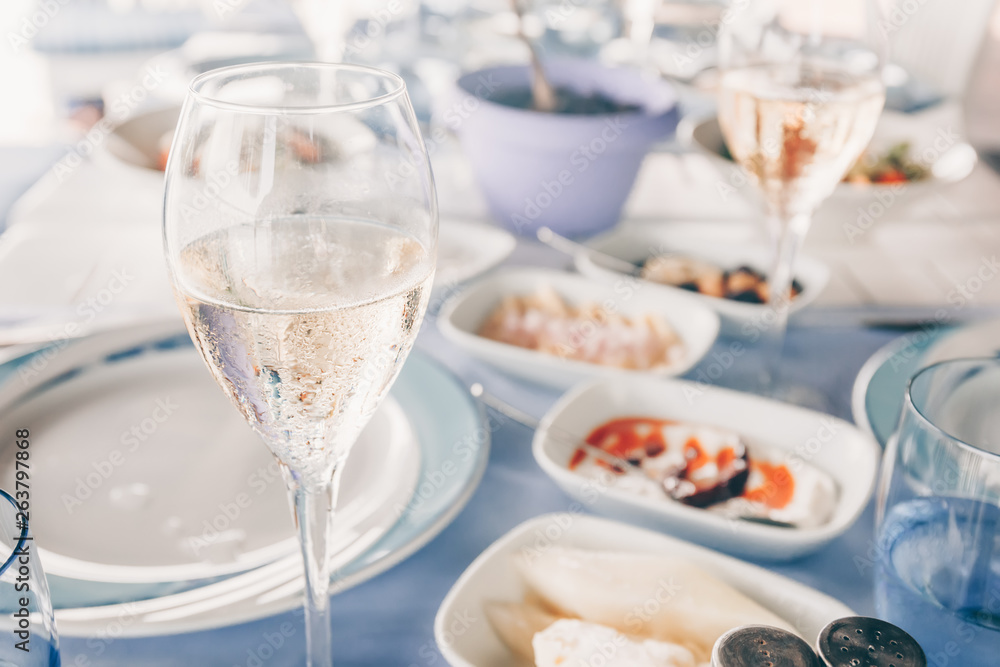 Wine and meze appetizers at the local greek restaurant. Healthy vegetarian snacks. Local mediterranean cuisine. Friendly dinner or lunch Wine and meze appetizers at the local greek restaurant. Healthy vegetarian snacks. Local mediterranean cuisine. Friendly dinner or lunch