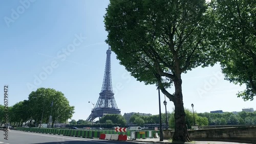 Cinematci view of Eiffel Tower in Parris with street traffic photo