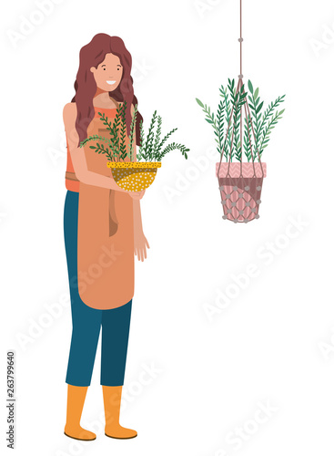 woman with houseplant on macrame hangers