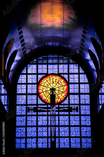 Os vitrais da  Catedral Basílica Santuário Nacional de Nossa Senhora da Conceição Aparecida. Religião, cristianismo, devoção, devotos. Santos e santas. 12 de outubro. Cruz no alto. Azul. photo