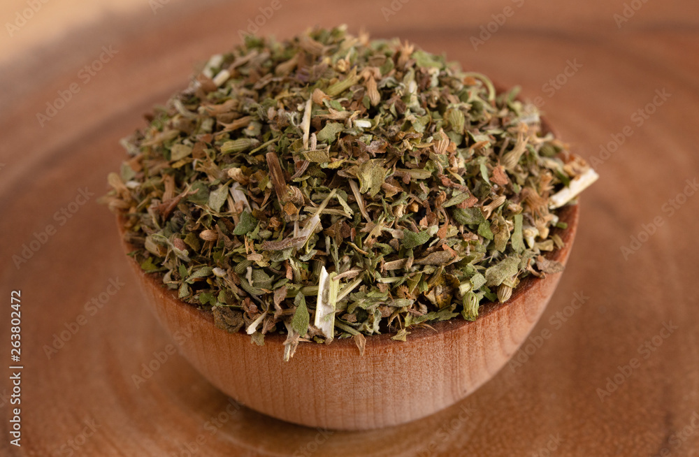 Bowl of Catnip on Wooden Table Bowl of Catnip on Wooden Table