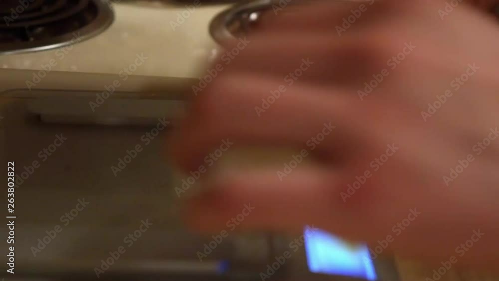 Person preparing food in the kitchen. 24 fps. Shallow depth of field. Person preparing food in the kitchen. 24 fps. Shallow depth of field.