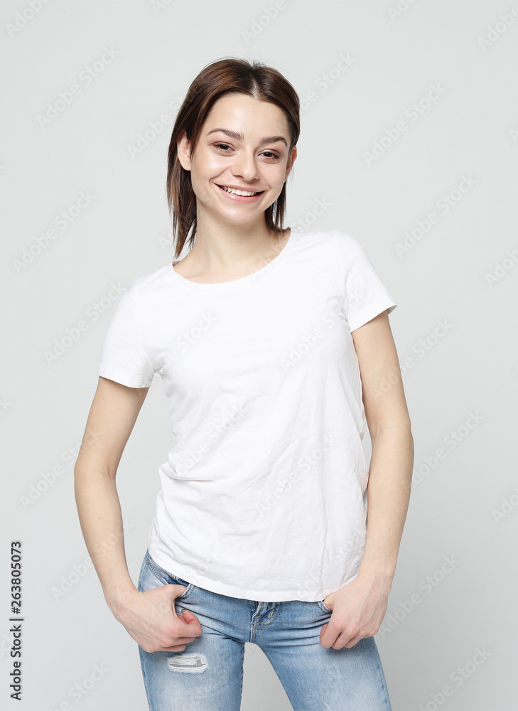 Portrait of young positive female with cheerful expression Portrait of young positive female with cheerful expression