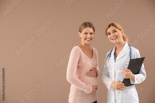 Gynecologist with young pre...