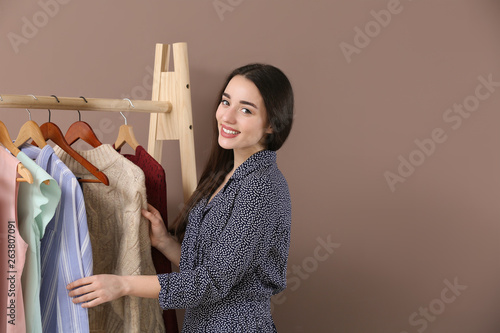 Young woman standing near c...
