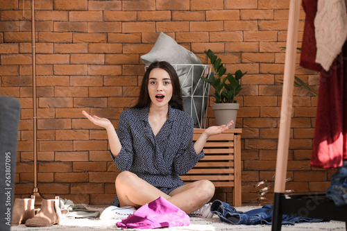 Shocked young woman choosin...