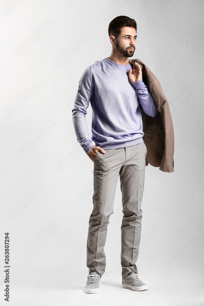 Handsome stylish man on light background Handsome stylish man on light background