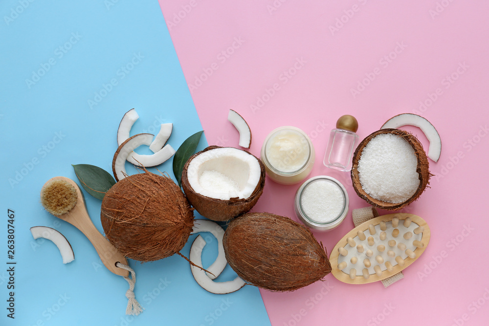 Composition with coconut oil and cosmetics on color background Composition with coconut oil and cosmetics on color background