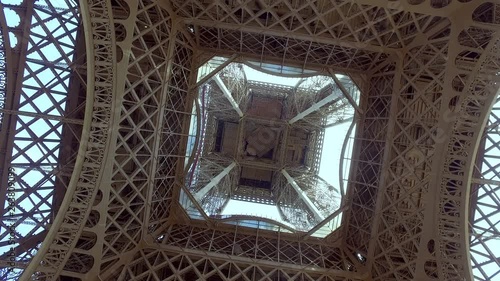 Sightseeing Tourist Landmark Eiffel Tower in Paris, France, cinematic shot from under the tower photo