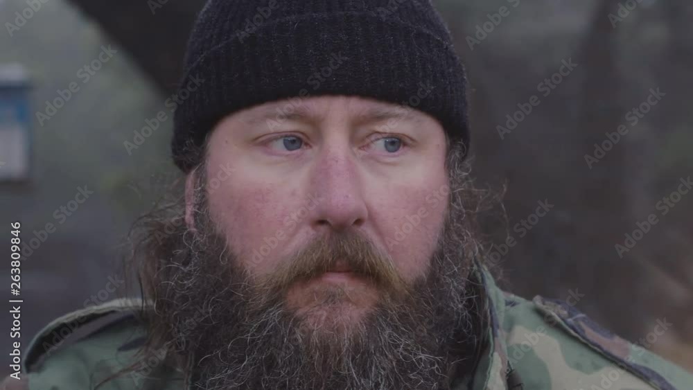 Close up of a male hunter wearing camouflage looking & listening for wildlife in the woods during winter, 60 fps. Close up of a male hunter wearing camouflage looking & listening for wildlife in the woods during winter, 60 fps.