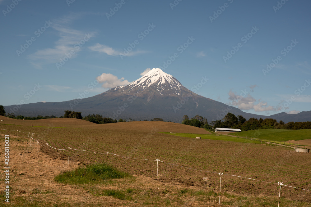 Agricultural farm land surrounding Mount Taranaki volcano