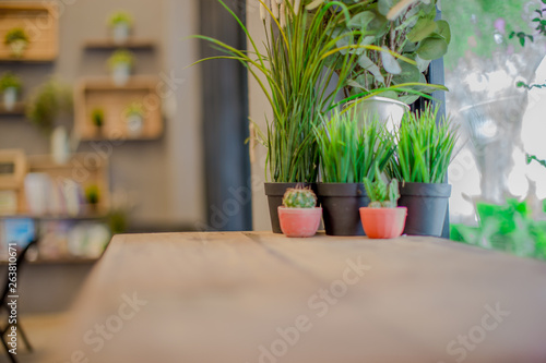 Blurred background of interior room  bakery coffee restaurant  by bringing a vase  wooden table Bookshelves  for the beauty of the shop and impressing those found 