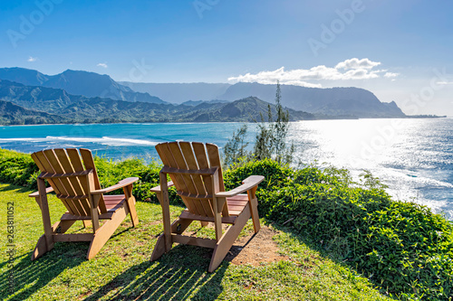 lounging chairs overlooking Hanalei Bay and the Na Pali coast Princeville Kauai Hawaii USA photo