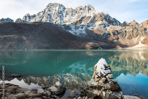 Beautiful reflection of the mountains on Gokyo lakes at sunrise in Gokyo village one of the most tourist attraction place in Solukhumbu district of Nepal.