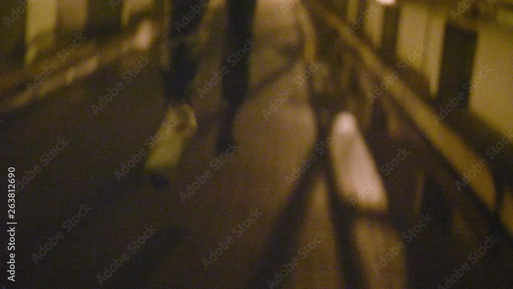 Close up of feet running away at night