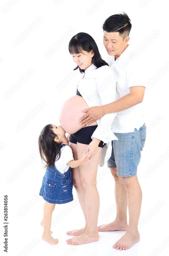 Girl touching her pregnant mother belly and smiles. Girl touching her pregnant mother belly and smiles.