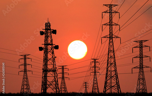 silhouette electricity pole, electricity pylons technology on sunset time background