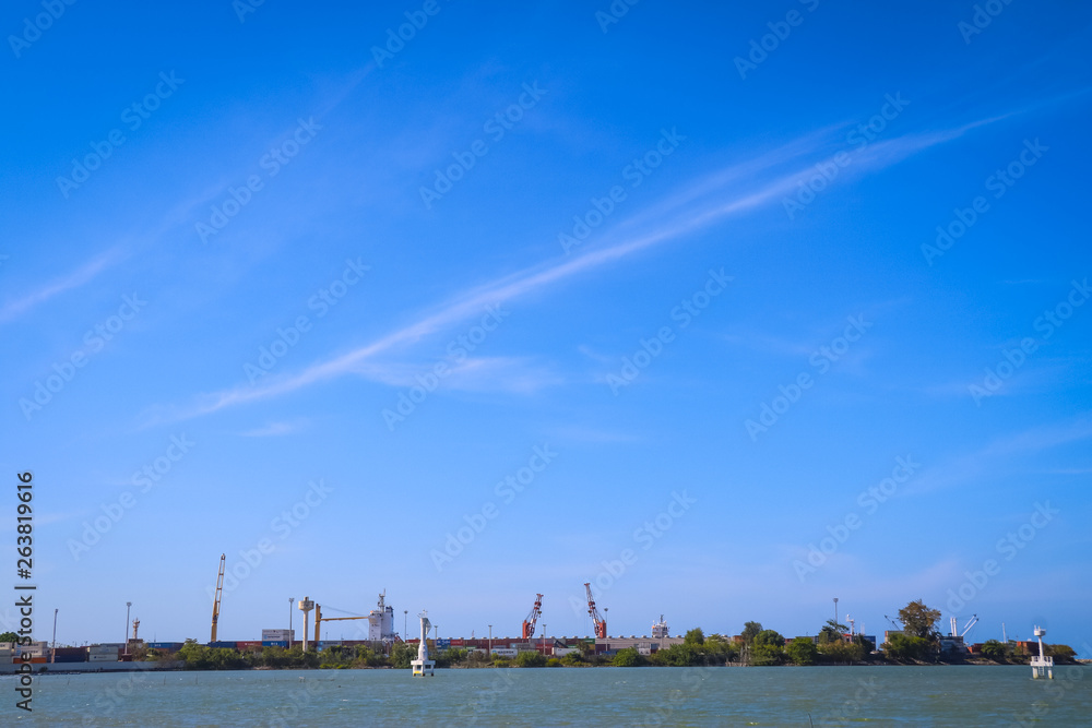 Fototapeta premium Container in the port, Logistics and transportation of containers, View on seaport with cranes at day 