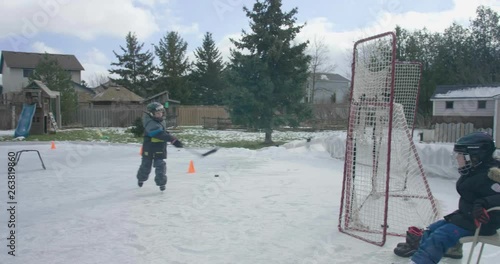 hockey kid backyard doing more drills photo