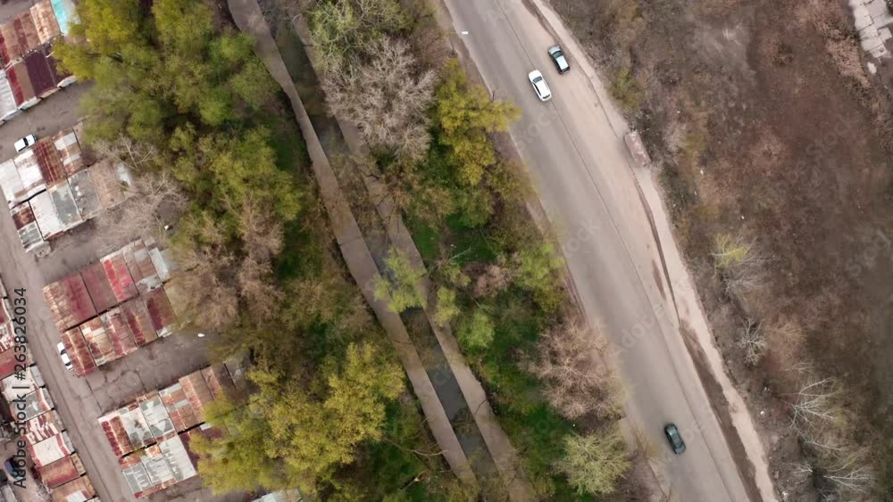 Top down aerial shot, flying over a street in Kievs industry area, near train tracks. Top down aerial shot, flying over a street in Kievs industry area, near train tracks.