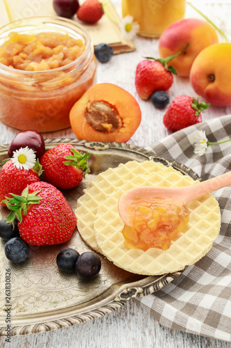 Tasty and healthy breakfast: waffles with fruit jam.