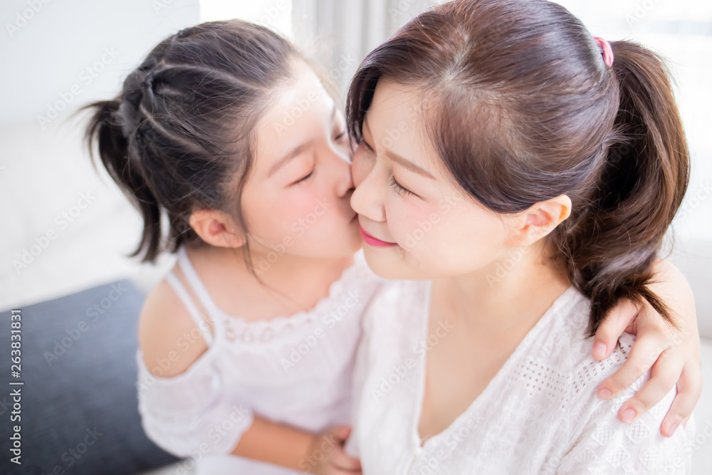 Daughter kiss mom tenderly Daughter kiss mom tenderly