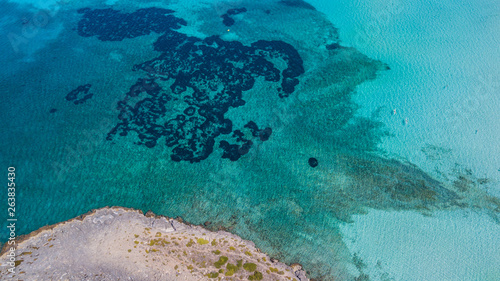 Amazing drone aerial landscape of the charming beach Es Trencs. It has earned the reputation of Caribbean beach of Mallorca. Spain © Matteo Ceruti