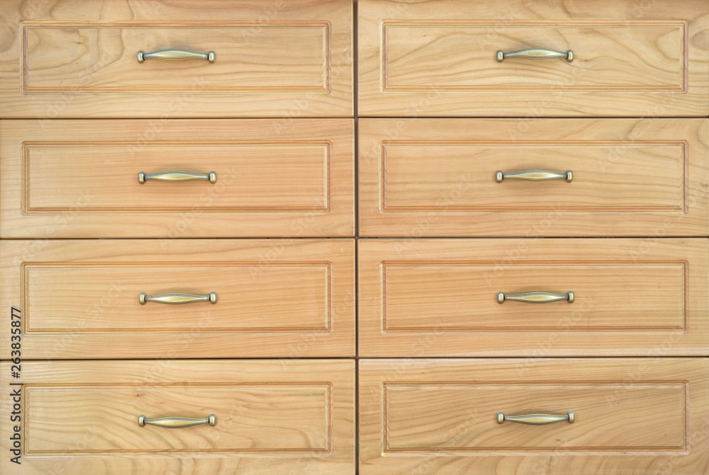 Wooden closed drawers with gold handles. Wooden closed drawers with gold handles.