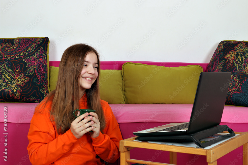 teenage girl watching fun media content on the laptop teenage girl watching fun media content on the laptop