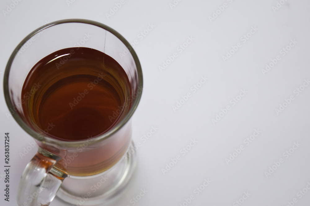 Black tea in a glass cup isolated on a white background Black tea in a glass cup isolated on a white background