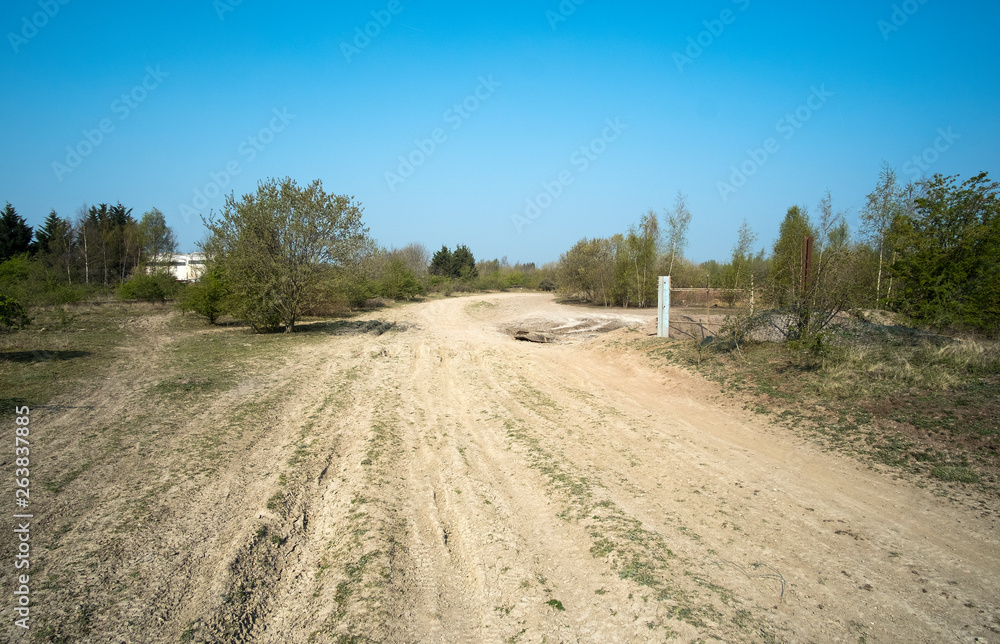 Naklejka premium Dusty dirt road track