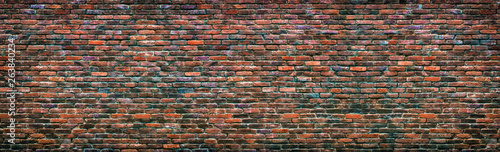 Fototapeta Colorful brick wall background. Old masonry texture
