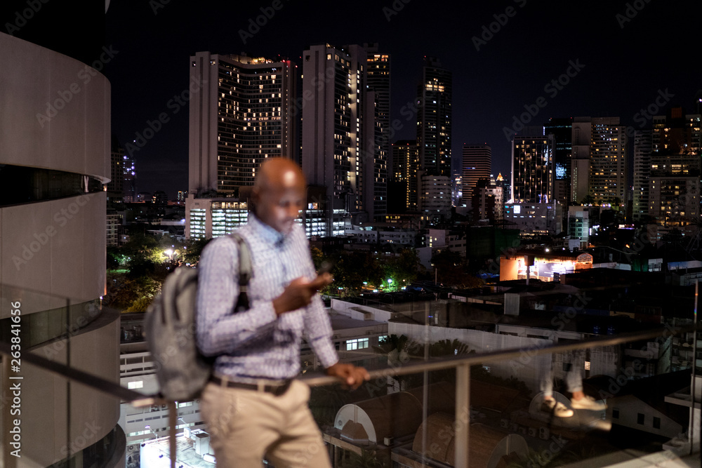 Man using his phone at night Man using his phone at night