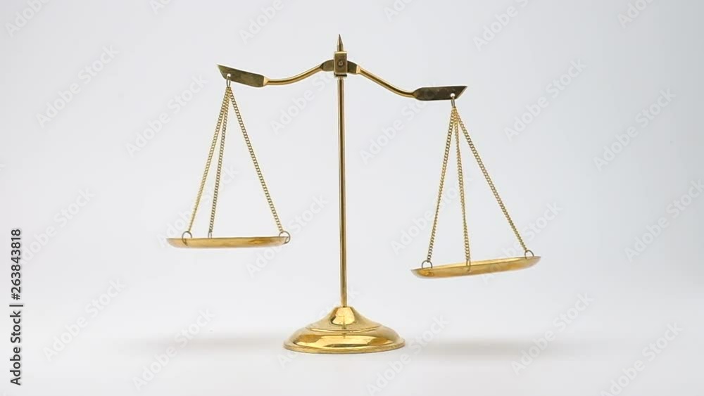 Slow motion of Gold brass balance scale isolated on white background. Slow motion of Gold brass balance scale isolated on white background.