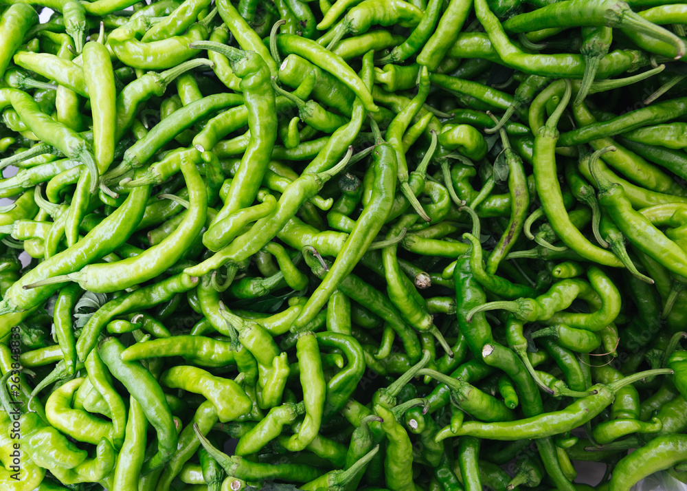 Pile of green chilli peppers at Farmers Market, New York City Pile of green chilli peppers at Farmers Market, New York City