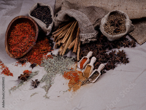 Set of colorful dry seed and powder on wood background on top view. Food art concept. Asian Herbs in Kitchen.