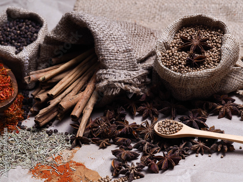 Set of colorful dry seed and powder on wood background on top view. Food art concept. Asian Herbs in Kitchen.