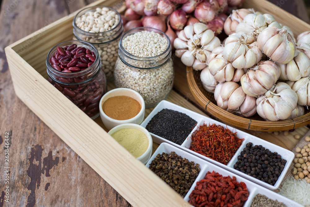Cereal grains , seeds, beans,spices on wooden background.