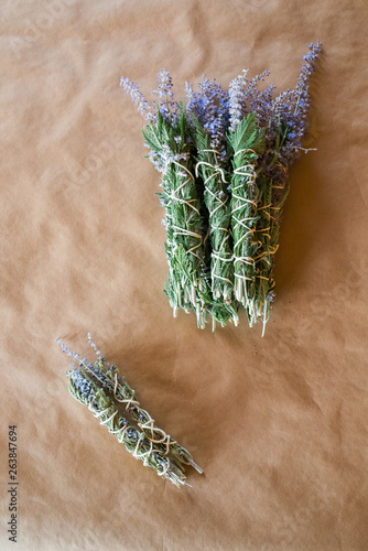 freshly bound sage bundles to dry and become smudge sticks photo