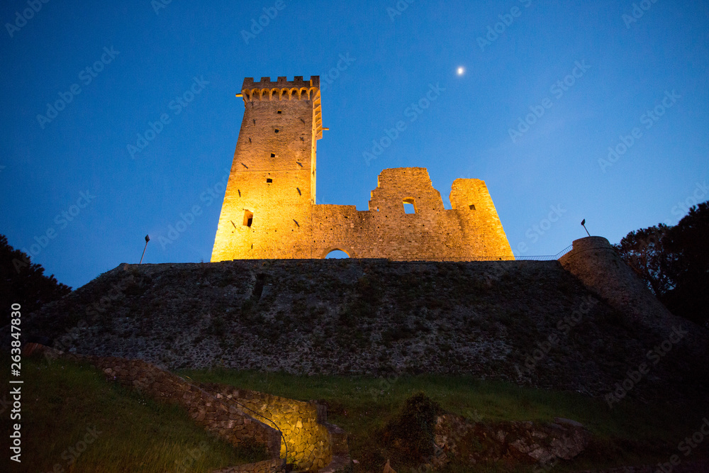 Fototapeta premium ruins of medieval castle in moonlight in the village of castelnuovo magra tuscany italy