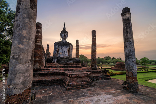 Ancient Buddhist temple in Sukhothai at sunrise, Thailand photo