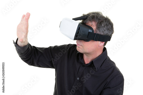 profile man in vr glasses play video games with virtual reality headset try to touch something with hand