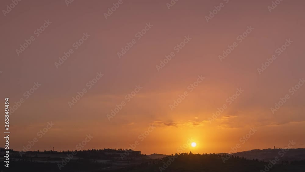 Beautiful orange sky with moving clouds and sun go down. Time lapse shot in Jerusalem Beautiful orange sky with moving clouds and sun go down. Time lapse shot in Jerusalem