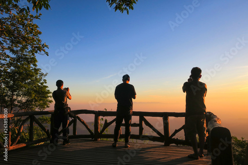 KANCHANABURI PROVINCE, THAILAND - MARCH 30, 2019: People take photos the sunrise at the viewpoint, Thong Pha Phum National Park, Kanchanaburi, Thailand