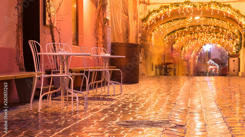 Photography street cafe at the night against city illumination lights