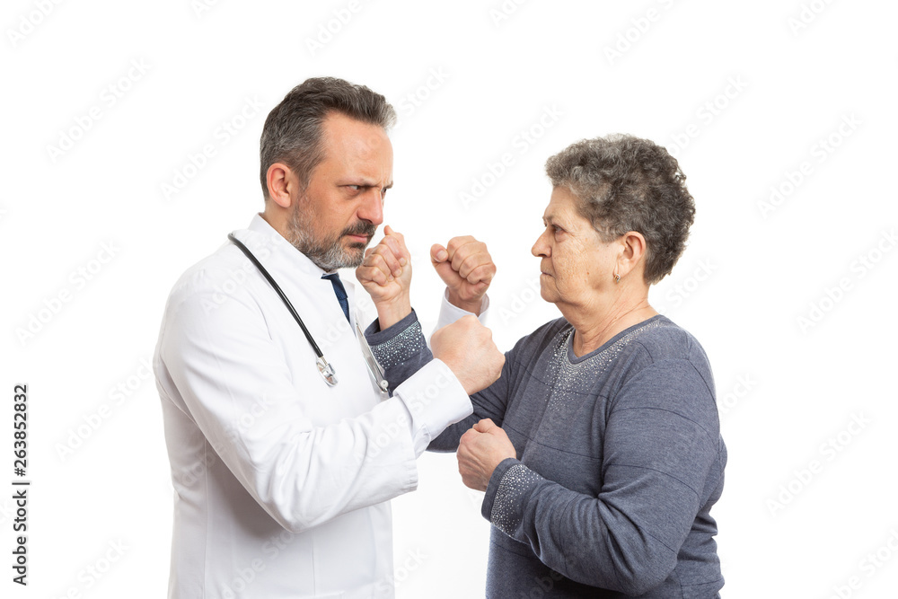 Doctor and patient fighting with fists Doctor and patient fighting with fists